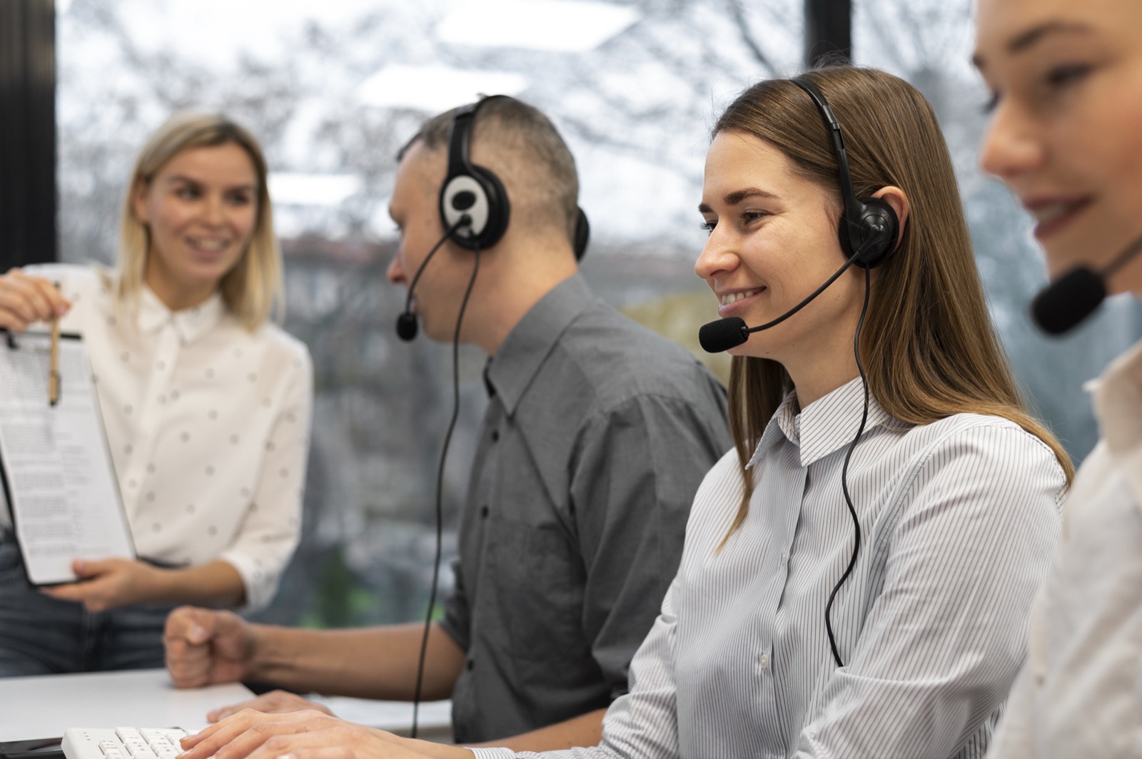Interviewers working together in a call centre